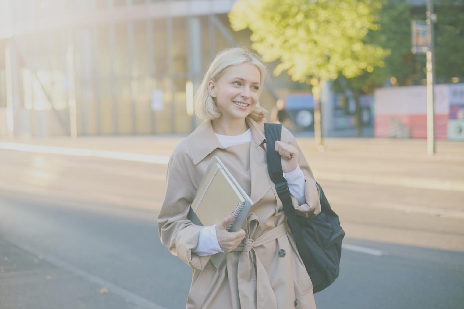 Technical support specialist working at modern help desk with multiple screens showing system monitoring dashboards