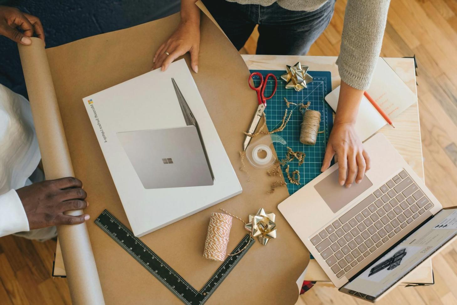 Modern workstation setup with dual monitors displaying investment portfolio analytics dashboard